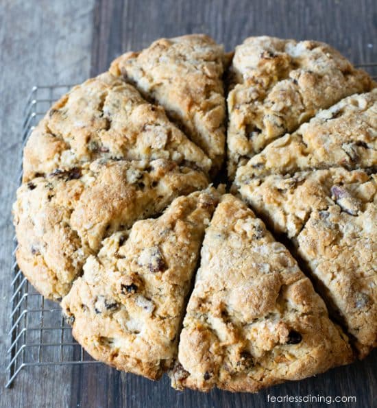 Baked gluten-free fruitcake scones on a cooling rack.