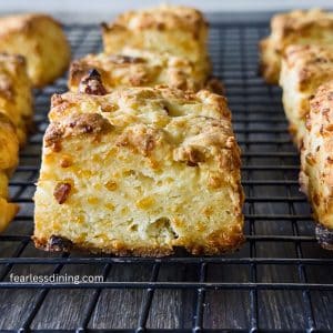Gluten free cheddar bacon biscuits on a cooling rack.