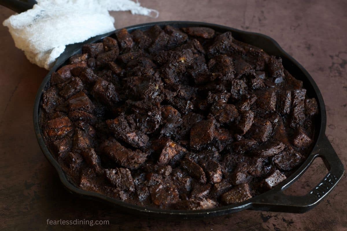 The baked gluten free chocolate bread pudding in the skillet.