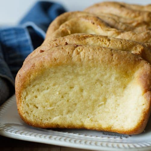 A photo of the loaf of gluten free garlic pull apart bread on a serving dish.