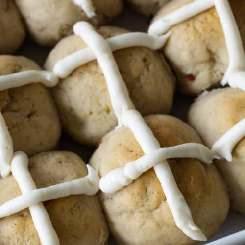 Baked gluten free hot cross buns in a baking dish.