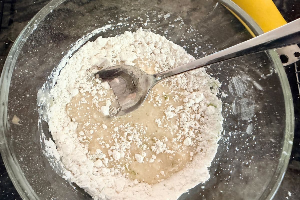 Mixing the lime icing in a small bowl.
