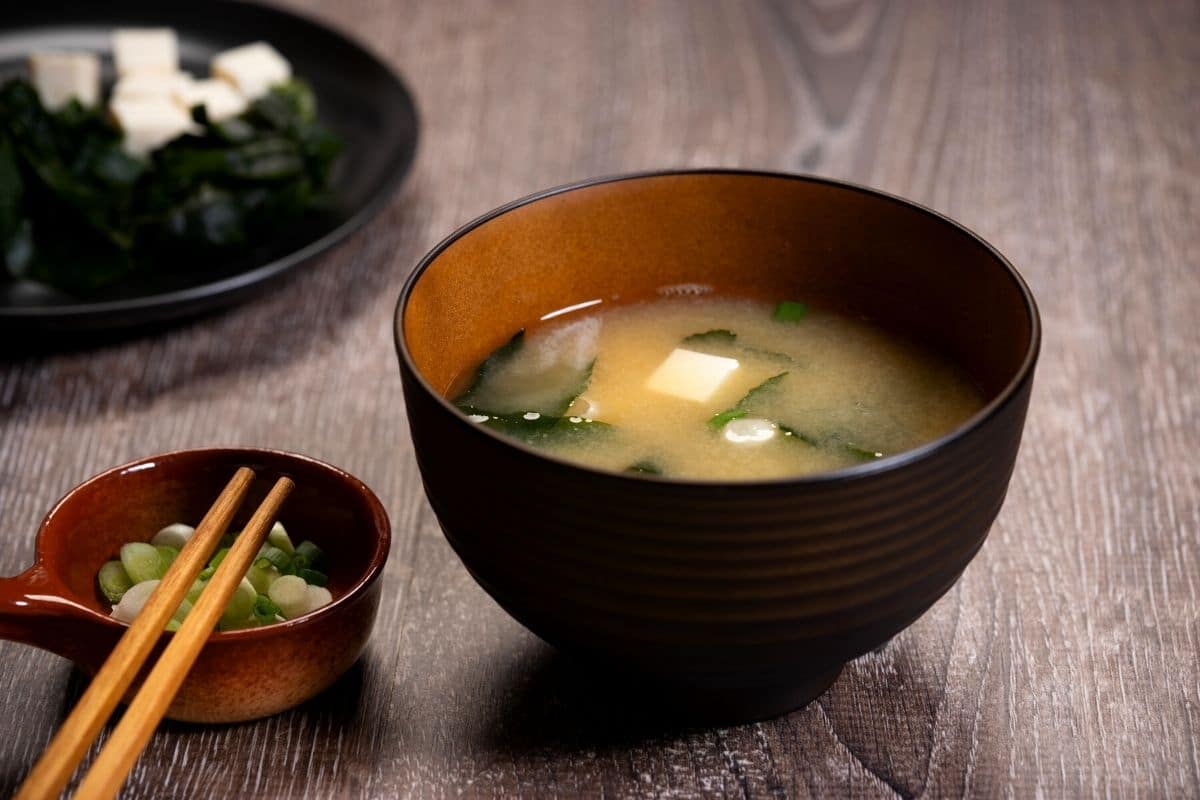 A small bowl of miso soup at a restaurant.