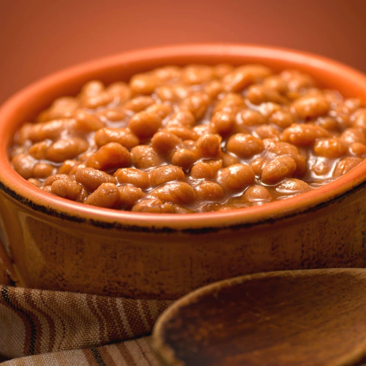 Cooked baked beans in a serving bowl.